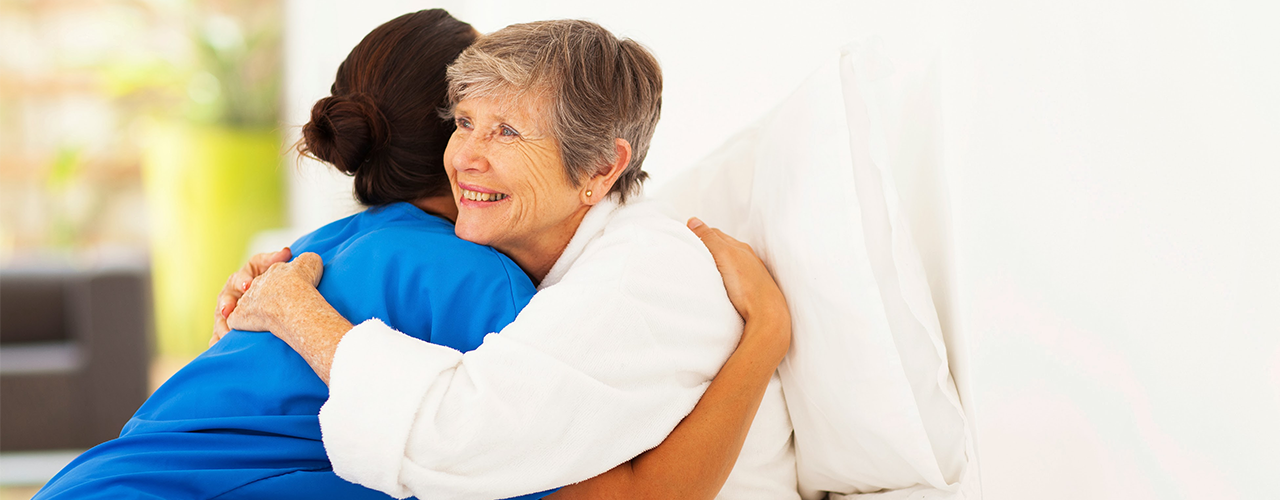 Hospice Patient and Nurse Nurse hugging patient