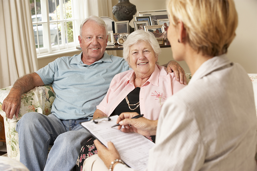 Senior couple with financial advisor Senior couple with financial advisor