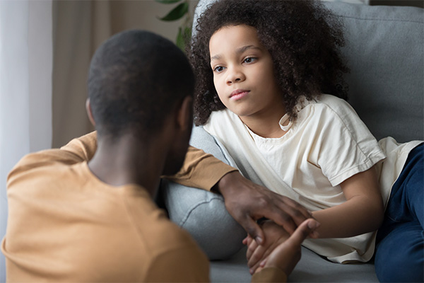 Teen daughter talking to father