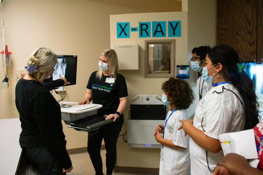 Middle school campers view an xray