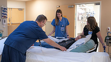 doctors and nurse helping patient