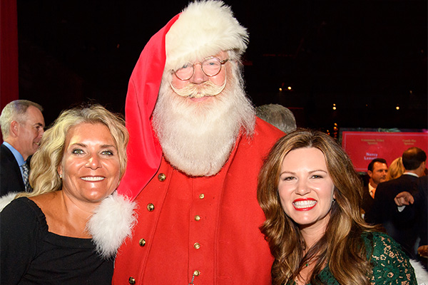 Santa and two gala attendees