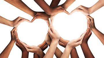 Several sets of hands shaped into two hearts