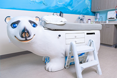 Pediatric exam table shaped like a polar bear