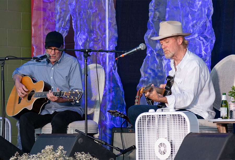 Storytellers Two guitarists on stage