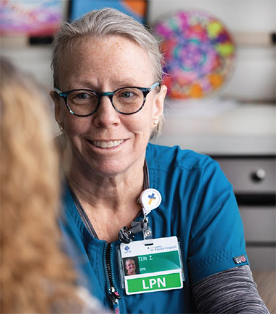 Caregiver smiling at a patient
