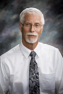 Dr. Bill Bekemeyer in white shirt and tie