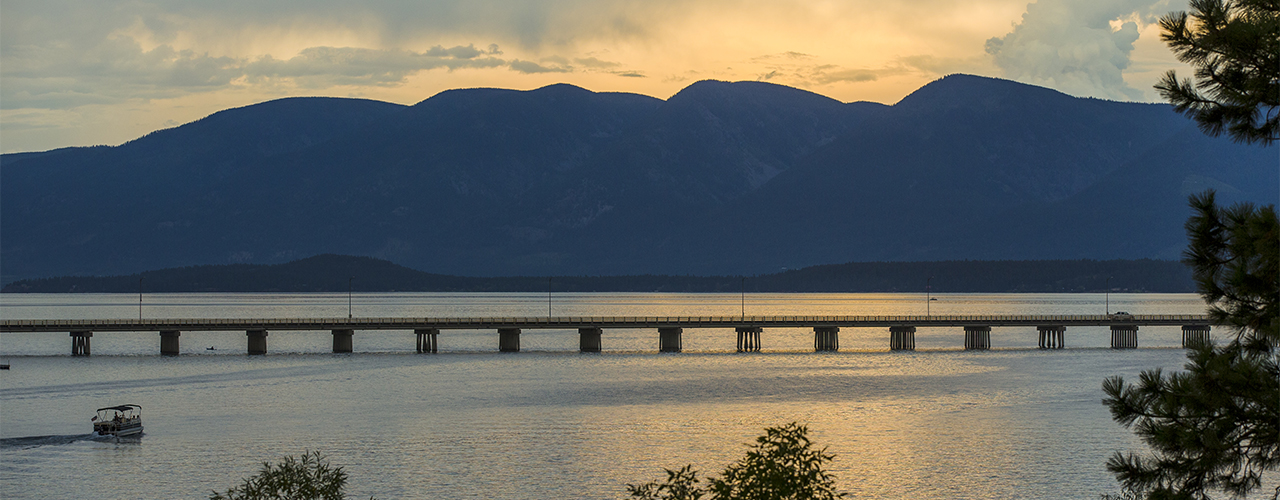 Mountains, lake, and a bridge
