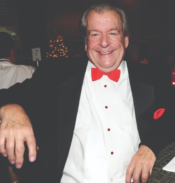 Gary Rasche wearing a tuxedo with red bow tie