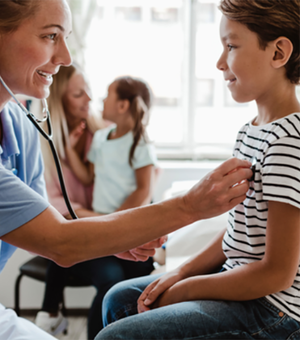 Doctor and Patient Doctor listens to young patient's heart