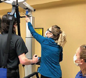 Rehab Patient using LiteGait therapy device