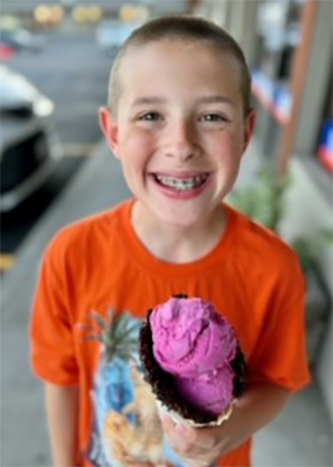 Levi with ice cream cone Smiling boy holding ice cream cone