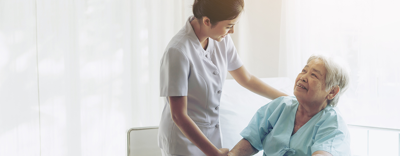 Nurse and patient Nurse talking to patient