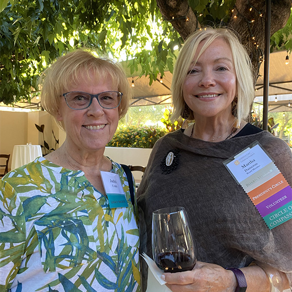 Martha Dameron Two women at event.