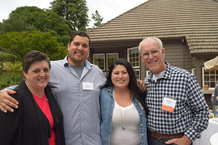Mixology Four donors with their arms around shoulders.