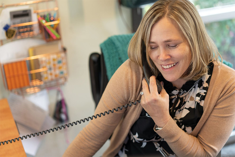 Woman on Phone Woman in office on telephone.