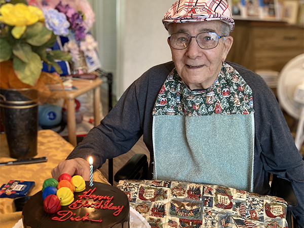 elderly man with birthday cake